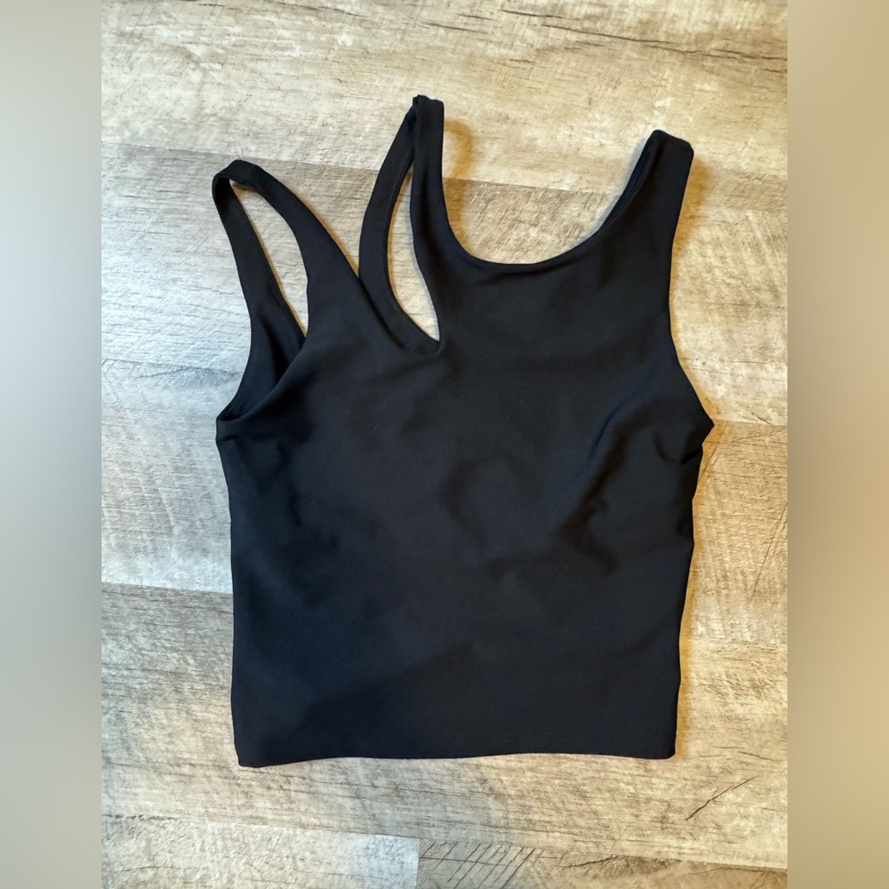 Becca black size XS athletic top, asymmetric strap detail